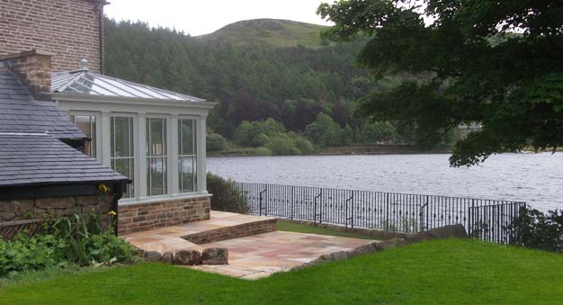 Conservatory with classical columns and margin-design windows