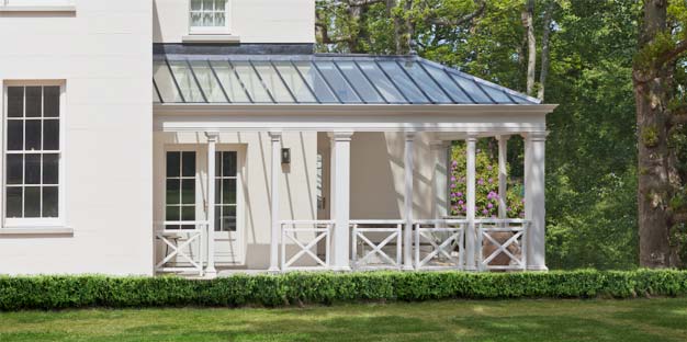 Open veranda with classical columns and a glazed roof