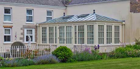 Large traditional conservatory with Georgian windows and ball finials
