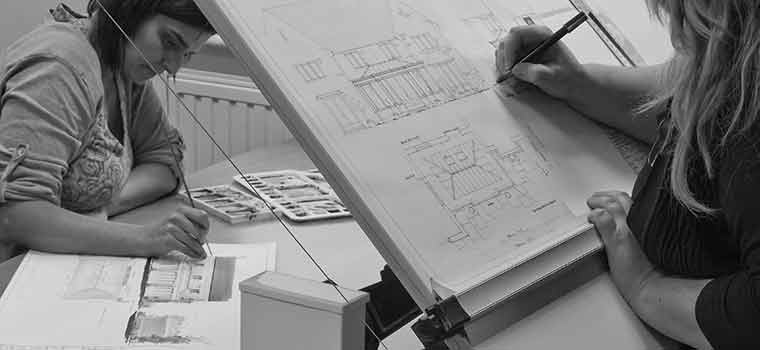 Vale designers drawing a conservatory design by hand